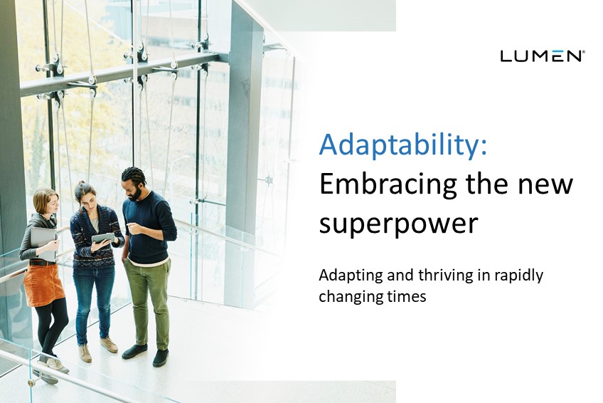 Group of business people standing and conversing with windows in the background and text that reads "Adaptability: The new superpower."