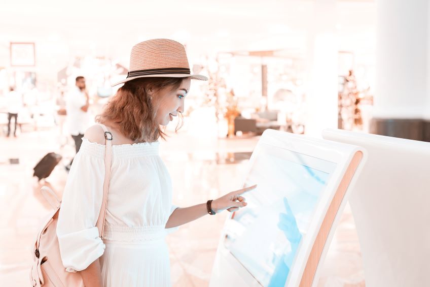 Retail customer browsing at an in-store kiosk