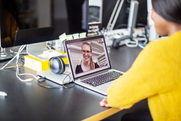 Two workers on a video call made easy with a UC&C solution.